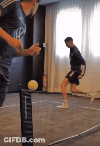 Men Playing Soccer With TF Sports Net GIF