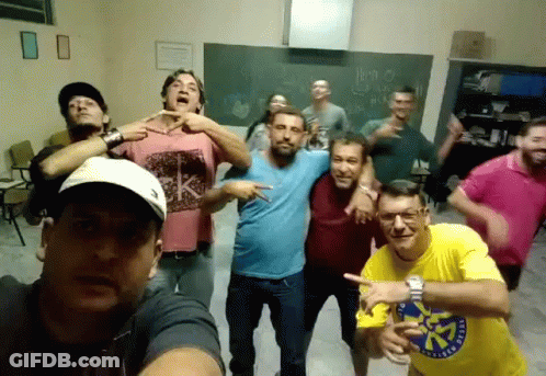 Men Posing With Yellow Shirt Saying A GIF