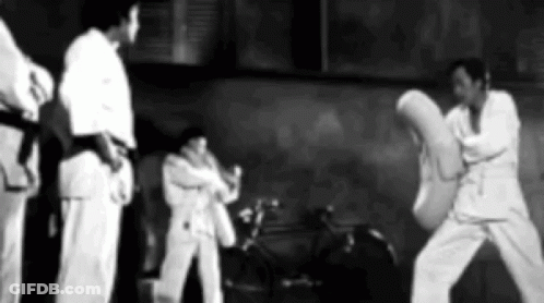 Men Practicing Martial Arts In Gym GIF