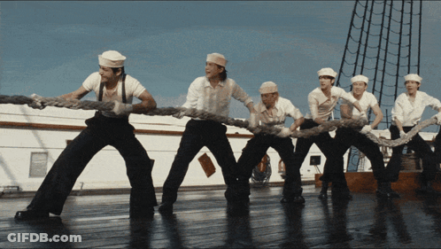 Men Pulling Rope On Ship GIF