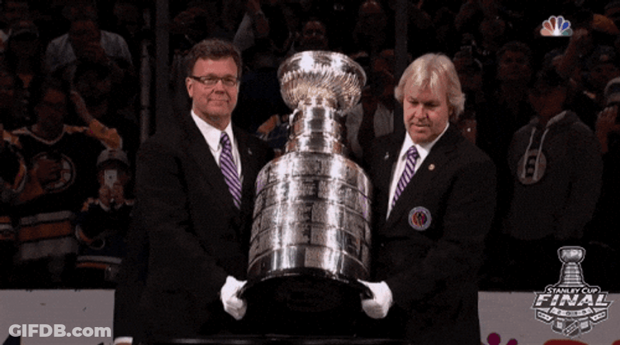 Men Putting Stanley Cup On A Table GIF