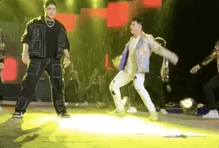 Men Rain Dance On Stage GIF