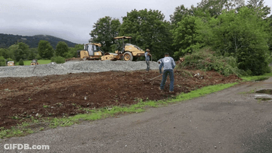 Men Raking Mulch On Roadside GIF
