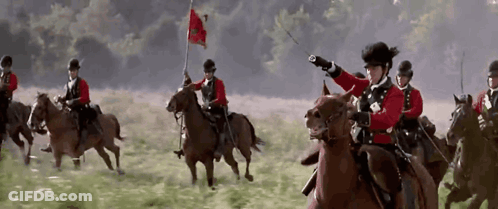 Men Riding Horses With Flag GIF