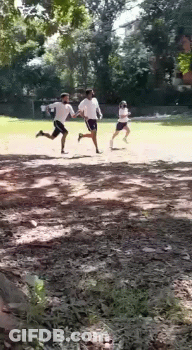 Men Running On Dirt Field GIF