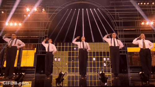 Men Saluting On Stage Saying Non GIF