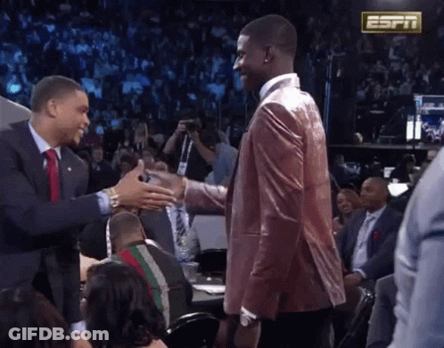 Men Shaking Hands In Front Of ESPN Sign GIF