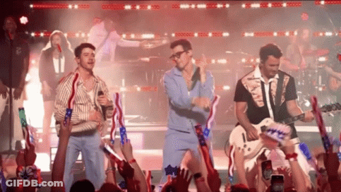 Men Singing And Playing Guitars For Crowd GIF