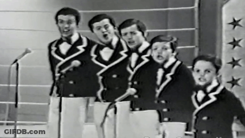 Men Singing Into Microphones On Star Wall GIF