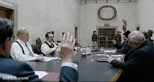 Men Sitting Around Table GIF