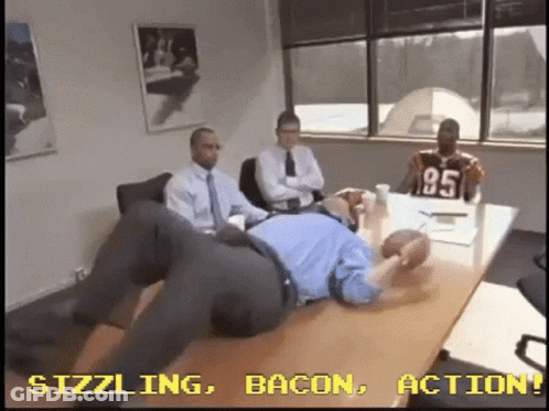 Men Sitting Around Table One Wearing Jersey 95 GIF
