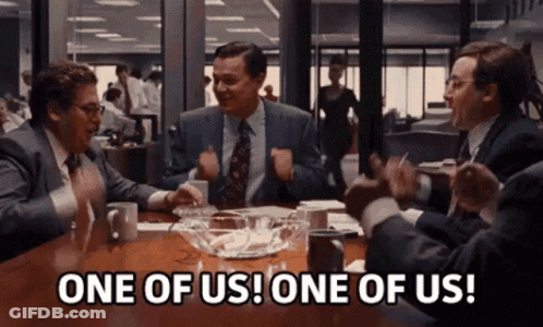 Men Sitting Around Table GIF
