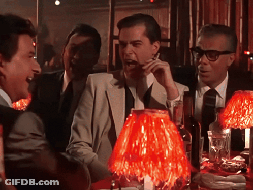 Men Sitting Around Table With Red Lamp GIF