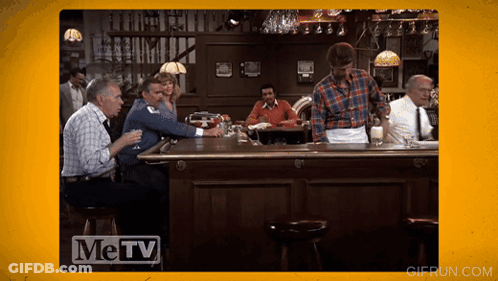 Men Sitting At Bar With Metv Logo GIF