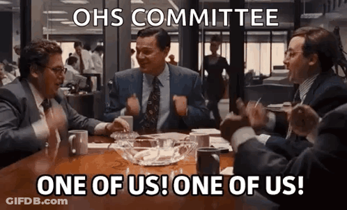 Men Sitting At Table Shouting One Of Us GIF