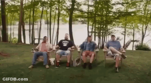 Men Sitting In Chairs By Lake GIF