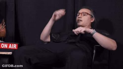 Men Sitting In Front Of Sign Saying Hey Ew GIF