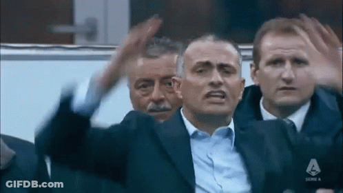 Men Sitting In Stadium One In Suit GIF