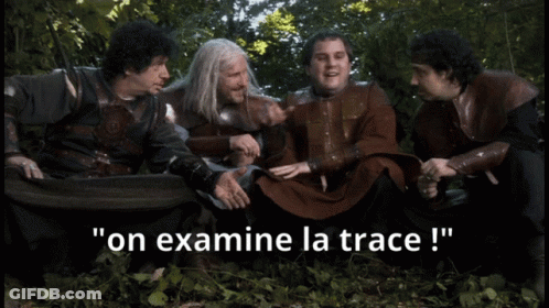 Men Sitting In Woods Say On Examine La Trace GIF