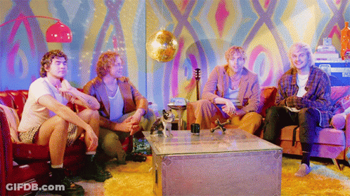 Men Sitting On Couch With Disco Ball GIF