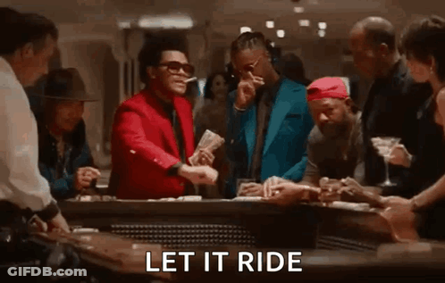 Men Standing Around Casino Table With Money GIF