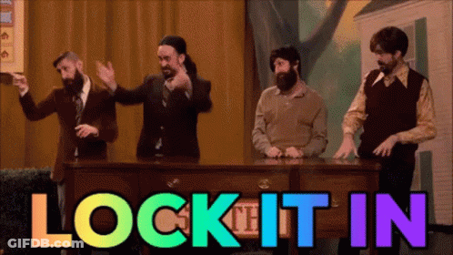 Men Standing Around Desk Lock It In Rainbow Colors GIF