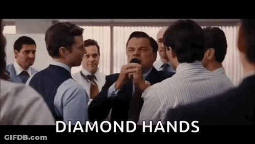 Men Standing Around Man With Diamond Hands Sign GIF
