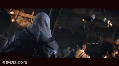 Men Standing Around Table In Dark Room GIF