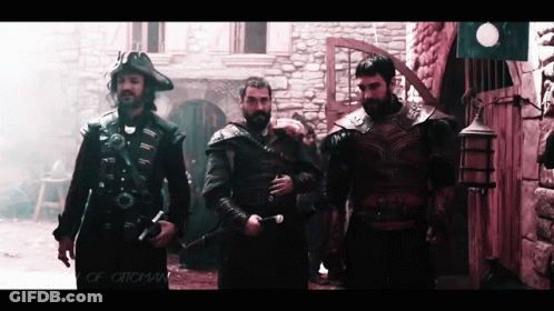 Men Standing Before Stone Building Saying Ottomans GIF