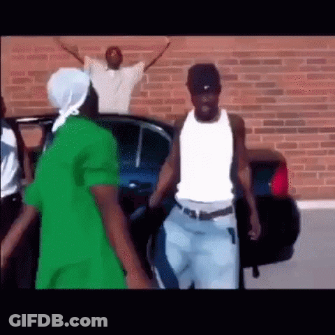 Men Standing Beside Car And Brick Wall GIF