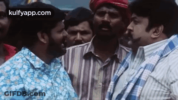 Men Standing In Crowd Talking GIF