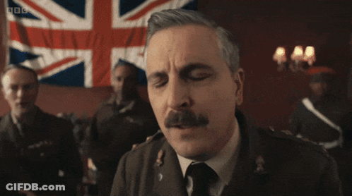 Men Standing In Dark Room With BBC GIF