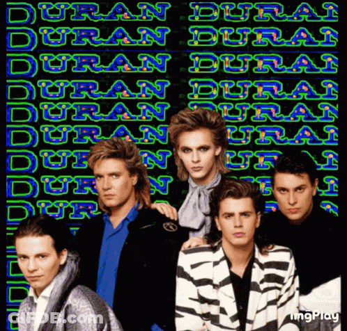 Men Standing In Front Of Duran Duran Neon Sign GIF