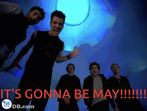Men Standing In Front Of May Background GIF