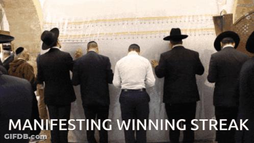 Men Standing In Front Of Wall Manifesting Winning Streak GIF
