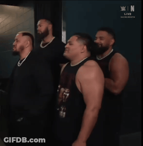 Men Standing In Front Of WWE Live Sacramento Wall GIF