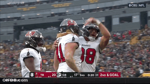 Men Standing In Kitchen Holding Bottles GIF