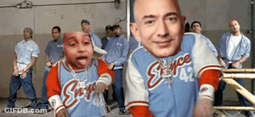 Men Standing In Room One Wearing Space 42 Shirt GIF