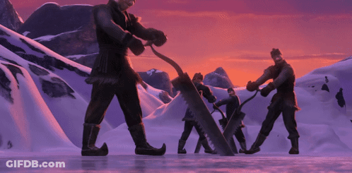 Men Standing In Snow Using Large Saw GIF