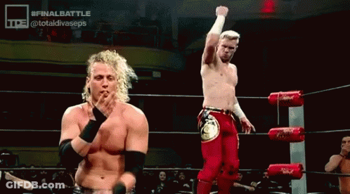 Men Standing In Wrestling Ring Fist Raised GIF