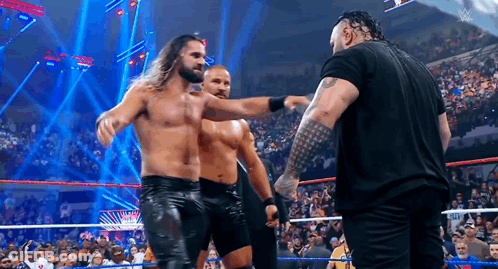 Men Standing In Wrestling Ring Talking GIF