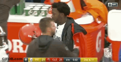 Men Standing Near NFL Table GIF