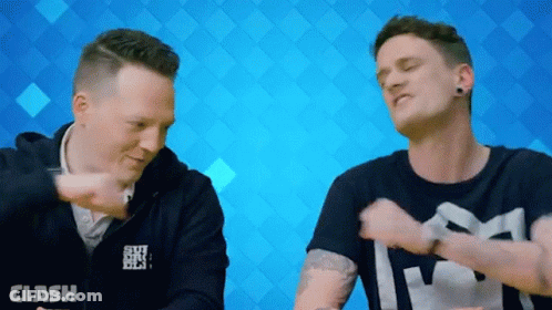 Men Standing Next To Each Other GIF