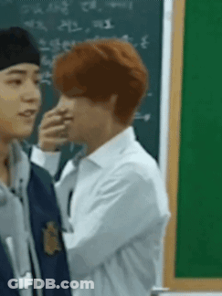 Men Standing Next To Each Other In Front Of Blackboard GIF