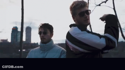 Men Standing Next To Each Other GIF