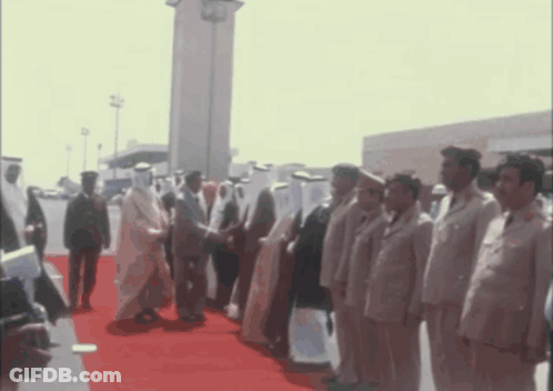 Men Standing On Red Carpet GIF