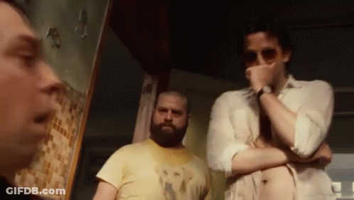Men Standing Together In Dark Room GIF