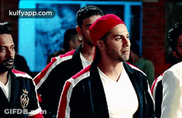 Men Standing Together In Room GIF