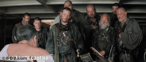 Men Surrounding Man Saying It's All Right Captain GIF