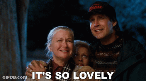 Men Talking, One Wearing Hat And Sweater GIF